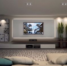 a large flat screen tv mounted to the wall in a living room