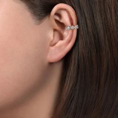 This exquisite ear cuff showcases a selection of 0.15 carat round diamonds, encased in intricately designed square frames with detailed milgrain edges. Measuring 13.5mm (1/2 inch) in diameter, these earrings are versatile and can be clipped on any part of your ear, without the need for a piercing. Single hinged ear cuff (one included) Available in 14K or 18K white, rose or yellow gold, and platinum Includes earring box Includes jewelry appraisal Ships fully insured to point of delivery Gabriel Jewelry, Diamond Ear Cuff, Cuff Earring, Earring Box, Jewelry Appraisal, Ear Cuff Earings, Cuff Earrings, Square Frames, White Rose