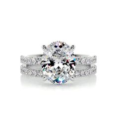 an oval cut diamond engagement ring with matching band