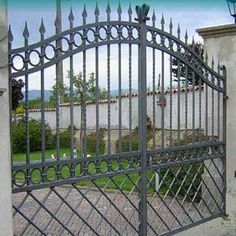 an iron gate in front of a house