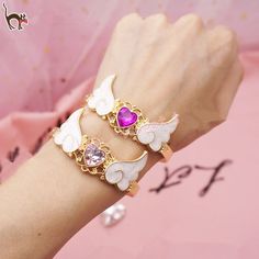 Magical Bracelet, Angel Wings Bracelet, Magical Girl Aesthetic, Angel Wing Bracelet, Heart Bracelets, Fairy Stuff, Heart Wings, Magical Boy, Rococo Fashion