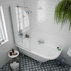 a white bath tub sitting next to a window