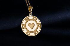 Enter the captivating realm of poker with our exquisite poker game and heart symbol necklace. Poker embodies the essence of risk, strategy, and the pursuit of fortune, where every hand holds the promise of victory or defeat. It's a game that thrives on passion, intuition, and the courage to take calculated risks. The heart symbol, with its timeless shape and universal significance, represents love, emotion, and the depth of human connection. Derived from the Tarot, the heart symbolizes compassion and empathy, reminding us that in the game of poker, as in life, empathy can be a powerful tool. Our necklace captures the spirit of the poker table, with its blend of excitement and tension, and the enduring allure of the heart symbol, symbolizing the bonds forged between players. Embrace the thr Symbolic Engraved Jewelry For Valentine's Day, Valentine's Day Symbolic Engraved Jewelry, Collectible Medallion Jewelry For Valentine's Day, Chip Necklace, Poker Game, Poker Chip, Symbol Necklace, Heart Symbol, Pendant Bails