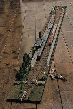 a model train is shown on the ground