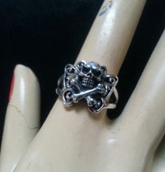 skull and cross bone soldered on filigree butterfly ring It is made from solid sterling silver (925) It weights approx 5.6 - 6..6 gms depending on the size The butterfly goes down the finger 15 mm It has a split shank and tapiers down to 3mm at the back I can make it any size !! I can also make this in all gold or with a gold skull on the silver ring. If a larger size is required then more silver is required therefor the price can increase just slightly accordingly... to size up or down 2 sizes Skull Butterfly, Gothic Boho, Sterling Silver Skull Rings, Silver Skull Ring, Cross Bones, Gold Skull, Clear Nail Polish, Butterfly Ring, Clear Nails