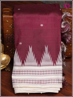 Berhampuri silk was introduced at Berhampur town in 14th century AD by the Mohuri Kings. It is known as ‘Silk City’ for its pure silk weaves. This Berhampuri silk saree is one of the traditional weaving and handloom heritage from Odisha. Experience class and elegance with this Maroon and Half white Berhampuri double pallu pure silk saree with phoda kumba(temple) borders. Extended double pallu in Half white and custom hanmade tassels on pallu adds grace to the saree. Part of the package is an uns Ceremonial White Traditional Wear With Weaving Work, Traditional White Tussar Silk Wear With Border, White Tussar Silk Traditional Wear With Border, White Saree With Woven Motifs For Traditional Ceremonies, White Traditional Wear With Woven Motifs For Ceremonies, Ceremonial White Traditional Wear With Woven Motifs, White Wedding Saree With Weaving Work, White Saree With Woven Motifs In Traditional Drape, White Chanderi Saree With Weaving Work