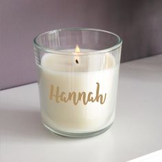 a candle with the word hannah written on it