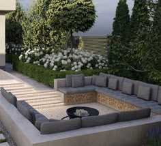 an outdoor living area with couches and stairs