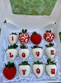 strawberries in a box with i love you written on them