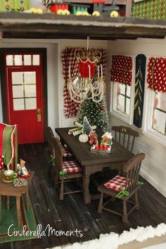 a doll house dining room with christmas decorations