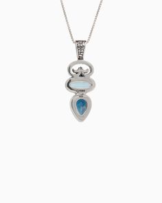 The North Shore Pendant showcases a petroglyph design accompanied by two exquisite stones: an oval faceted Hampton blue topaz and a faceted pear-shaped London blue topaz. Both the petroglyph and the bail are embedded in our exclusive turtle texture with petroglyphs, adding a distinctive and captivating detail. Whether worn solo for an elegant touch or layered for a bold statement, this pendant offers versatile style options. Pair with your favorite chain, sold separately. Metal: Sterling silver Blue Pear-shaped Jewelry With Polished Finish, Luxury Teardrop Blue Topaz Jewelry, Blue Topaz Oval Pendant Jewelry, Marquise Blue Topaz Gemstone Jewelry, Blue Topaz Gemstone Drop Jewelry, Turtle Texture, Hook Bracelet, Island Vibes, December Birthstone