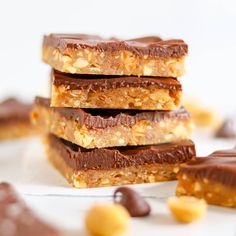 chocolate and peanut butter bars stacked on top of each other