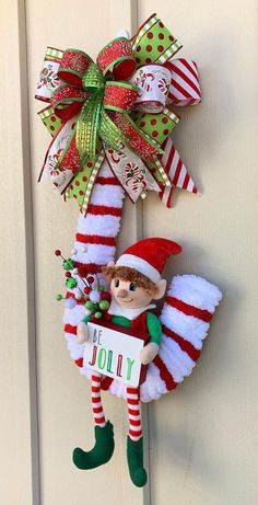 an elf is hanging on the front door