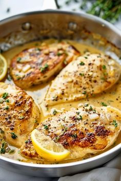 chicken with lemon and herbs in a pan