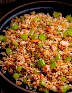 rice and vegetables are mixed together in a skillet