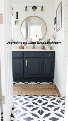 a bathroom with black cabinets and white walls