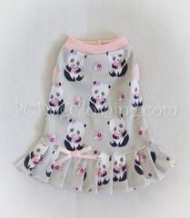 a white skirt with panda bears on it and pink trimming around the bottom,