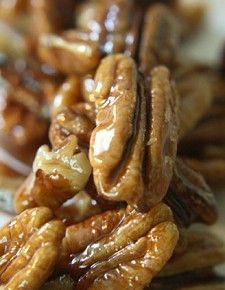 several pieces of pecans are stacked on top of each other with caramel drizzle