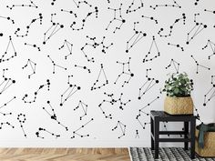 a room with a black and white wallpaper that has lines drawn on the wall