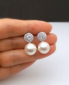 Best high-quality designer brand 12mm white or cream round crystal pearl with cubic zirconia halo micropave inlaid all around deco stud earrings. posts are sterling silver. Size: 2.2cm x 1.2cm Bride Earrings Pearl, Ear Earrings, Bride Earrings, Pearl Design, Party Earrings, Jewelry Wedding, Pearl Stud Earrings, Bridesmaid Earrings, Pearl Studs