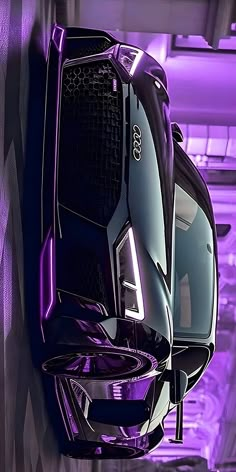 the front end of a futuristic car in purple light