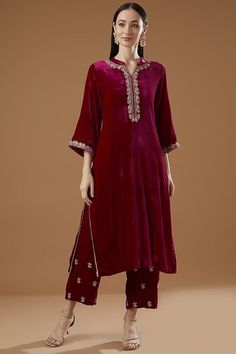 Featuring a pink kurta in velvet base with hand embroidery. It is paired with matching embroidered palazzo pants. This product will be shipped to you after 1-2 weeks from the date of order placed. All custom made orders are not returnable. Pls contact for Size chart and for other more colors Request You :To provide contact details for courier services. {VARIATION MAY COME DEPENDING UPON AVALIBILITY OF LACES OR GOTTA PATI or TUSSELS} NOTE:  1) Visual Samples on website may differ slightly from actual product due to light & effects during photography (Length & Breadth have 1 n 1.5 inches +/-). 2) Before placing order ,pls confirm product n color availability and  For Wholesale Order MOQ is 5 Pieces of any color/Pattern on +91 7903893945 & +91 8447750028(WhatsApp) Bridal lehanga ,indian weddi Valvet Suits, Chudidhar Designs, Marriage Suits, Velvet Dresses Outfit, Velvet Suit Design, Velvet Dress Designs, Indian Designer Suits, Velvet Dresses, Velvet Clothes