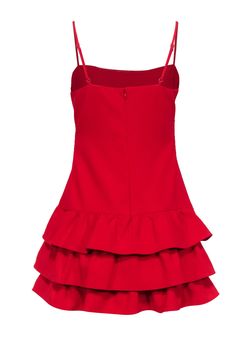 Wow your fashion game in this Likely red sleeveless mini dress with a flirty ruffled bottom. Perfect for a bachelorette or sultry birthday dinner, this mini dress will have all your attention on you! Pair it with strappy black stilettos, statement earrings, and a mini bag for a killer look. Size 8 Shell 67% Polyester, 27% Rayon, 6% Spandex Lining 100% Polyester Invisible zipper back with top hook and eye closure Adjustable sleeveless straps Ruffled layered bottom Bust 32" Waist 29" Shoulder to hem 32.5" Party Mini Dress With Spaghetti Straps And Ruffle Hem, Flirty Tiered Mini Dress For Date Night, Party Mini Dress With Ruffle Hem And Ruffled Straps, Flirty Ruffle Dress With Ruffled Straps For Party, Mini Dress With Ruffled Skirt And Straps For Party, Flirty Tiered Ruffle Dress For Cocktail, Cocktail Mini Dress With Ruffle Hem And Straps, Red Spaghetti Strap Dress With Ruffle Hem, Flirty Mini Dress With Ruffle Hem For Cocktail