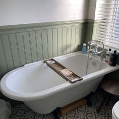 a bathtub and toilet in a small bathroom