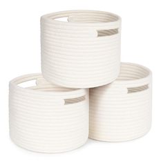 three white rope baskets stacked on top of each other in front of a white background