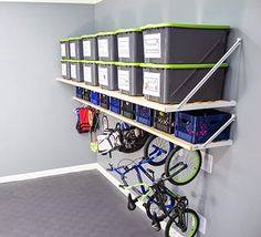 there is a bike and several bins on the wall