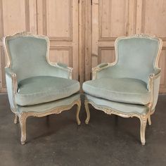 pair of antique french style chairs with blue velvet upholstered