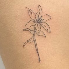 a flower tattoo on the back of a woman