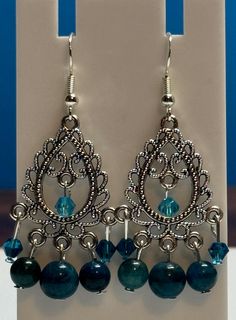 Beautiful apatite and crystal dangle Earrings. Made with sterling silver earwire and comes with earring backs. Be sure to check out the matching necklace and bracelet! I take pride in my work so if there are ever any problems with this piece, please let me know so we can get it fixed! I make one of a kind jewelry that will stand out! Will ship Quickly!! Blue Alloy Dangle Jewelry, Blue Dangling Beads Dangle Jewelry, Blue Metal Chandelier Earrings With Dangling Beads, Hypoallergenic Czech Glass Dangle Crystal Earrings, Silver Apatite Dangle Earrings, Nickel-free Apatite Dangle Jewelry, Handmade Blue Apatite Earrings, Crystal Dangle Earrings, Etsy Earrings Dangle