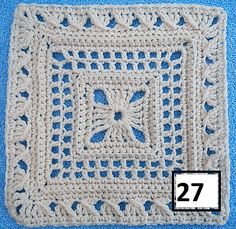 a crocheted square is shown with the number 27 on it's side