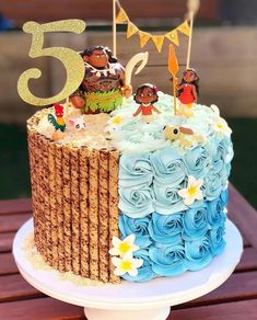 a birthday cake with blue frosting and decorations