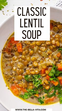 a white bowl filled with lentil soup and garnished with parsley