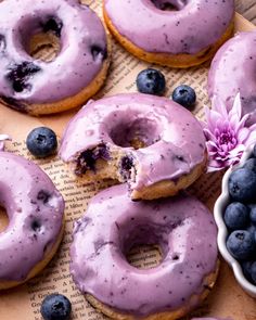 doughnuts with blueberries are on a table