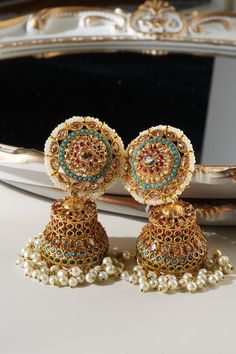 Samreen Jhumka Earrings - Gold-plated with multicolor navratan stones and zircon accents Turquoise Kundan Chandbali Earrings, Turquoise Kundan Earrings For Festivals, Turquoise Chandbali Jewelry With Latkans, Turquoise Jewelry With Latkans For Festivals, Traditional Turquoise Jewelry With Latkans, Festive Turquoise Jewelry With Latkans, Turquoise Latkans Jewelry For Festivals, Bohemian Bridal Earrings With Tilla For Celebration, Traditional Turquoise Danglers For Gift