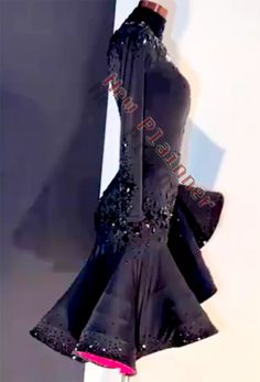 a black dress with sequins is on display