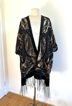 Gorgeous Amber and Black velvet, Art Deco, kimono, Burnout Kimono, night, dress, bathrobe, Velvet Robe, Handmade Amber and black Velvet Kimono Floral Design, semi sheer with velvet, beautiful fringe. Kimono has velvet in an art deco design and fringe hem Armholes Side slits Open front kimono, jacket. great for wearing over jeans, shorts, dresses and bikinis. Loose fitting fits size 6 to 22 Measurements:  width 36" (  74" all the way around) Length 31" fringe is an additional 6" 442 Gorgeous Ambe Festival Black Shawl Kimono, Black Long Party Robe, Black Open Front Evening Kimono, Black Bohemian Kimono With Kimono Sleeves, Black Open Front Kimono For Festival, Black Long Kimono For Party, Long Black Party Kimono, Black One Size Kimono, Black Open Front Kimono