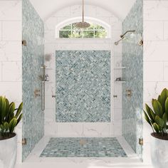 a white tiled bathroom with green plants in the shower