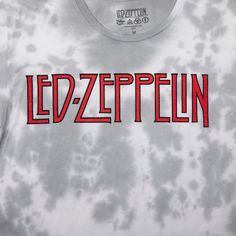 Step back in time to the legendary Led Zeppelin U.S. Tour of 1975 with this officially licensed T-shirt. The shirt features a striking blue-green cloud wash that adds a vintage, rock-inspired charm to your style. Crafted from a comfortable and durable blend of 60% cotton and 40% polyester, this Led Zeppelin shirt offers a soft feel and long-lasting quality. Whether you're a die-hard fan or simply appreciate classic rock history, this tee is a must-have addition to your collection. The easy-care instructions make upkeep simple: machine wash cold, tumble dry low, and avoid ironing if decorated. Embrace the spirit of rock 'n' roll with this Led Zeppelin U.S. Tour 1975 T-Shirt and pay homage to one of the greatest bands in rock history. Acid Wash Letter Print T-shirt Fan Merchandise, Casual Logo Print T-shirt For Music Festivals, Casual T-shirt With Logo For Music Festivals, Acid Wash Band Merch T-shirt With Letter Print, Band Merch Acid Wash T-shirt With Letter Print, Acid Wash Logo Print T-shirt For Summer, Acid Wash T-shirt With Logo Print For Summer, Summer Acid Wash T-shirt With Logo Print, Acid Wash Pre-shrunk T-shirt For Fan Merchandise