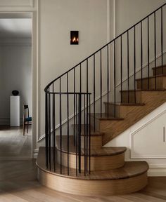 a wooden staircase with metal handrails in a house