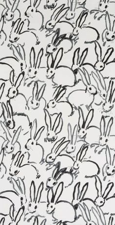 an image of many rabbits drawn in black and white ink on a sheet of paper