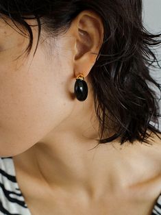 Indulge in the irresistible charm of our Black Onyx Moon Huggie Earrings! Crafted with sleek black onyx stones set in a moon-shaped huggie design, these earrings will add a touch of elegance and mystique to any outfit. Elevate your style and enchant those around you with these stunning earrings. Metal:Metal: 18K Recycled Gold Plated Vermeil on Recycled Sterling Silver/Recycled Sterling Silver Gemstones:Black Onyx Dimensions: length 27mm Weight: 8g each Black Minimalist Plug Earrings, Minimalist Black Single Plug Earring, Minimalist Black Pierced Jewelry, Black Huggie Single Earring, Black Single Huggie Earring As A Gift, Black Single Huggie Earring, Black Minimalist Pierced Earrings, Classic Black Clip-on Earrings, Modern Black Single Earring