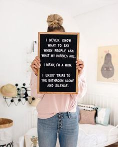 a woman holding up a sign that says i never know what to say when people ask