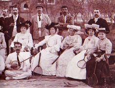 an old black and white photo of people with tennis rackets