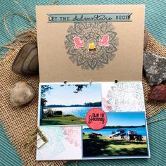 an assortment of greeting cards on top of a table with rocks and stones around them