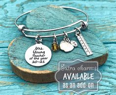 "{ o f f e r s... a n d... b o u t i q u e... u p d a t e s} Facebook... https://www.facebook.com/sa.jolie.boutique { d e t a i l s ... } This is such a beautiful charm bracelet which you can further personalize by adding additional charms . The perfect personalized gift To Personalize Add the item to your cart, you will then see a box that says \"note to seller\" in this box let me know ✿ Name (eg Mrs McVey, Alison etc) ✿ Year (eg 2017, 2018 etc) The bottom of the disc will only take 4 numbers, Personalized Adjustable Charms As Gifts, Personalized Adjustable Charms As Personalized Gifts, Personalized Adjustable Bracelets For Graduation, Turquoise Metal Charm Bracelet Gift, Personalized White Name Bracelet For Teacher Appreciation, Personalized Adjustable Bracelets For Graduation Gift, Personalized Adjustable Bracelet For Teacher Appreciation, Antique Silver Nickel-free Charm Bracelet For Gift, Teaching Assistant