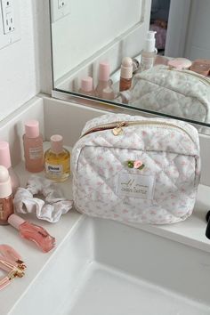 Exclusive castle pattern cosmetic bag. It is quilted and lined with a “made of magic” pink print, and features a heart zipper pull. Can be used a travel bag, makeup bag, tech bag, skincare bag, and so much more.Size: 8” x 6” x 4”100% Nylon *Final sale / not eligible for discounts Luxury Everyday Cosmetic Bag With Zipper, Luxury Cosmetic Pouch Bag, Affordable Trendy White Cosmetic Bag, Luxury Chic Cosmetic Bag, Luxury Elegant Cosmetic Bag, Jemina Makeup Bag Roller Rabbit, Douyin Makeup Bag, Cheap Kawaii Pouch Cosmetic Bag, Tote Bag Makeup Bag